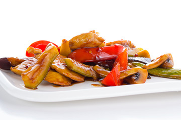 Warm thai salad on white plate over white background