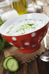 Summer soup with cucumbers, yogurt and fresh herbs