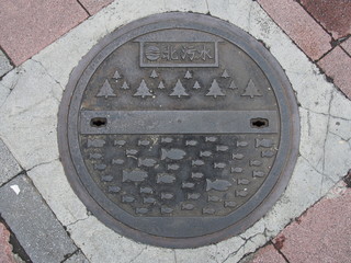 manhole drain cover on the street at Ximen in Taipei, Taiwan.