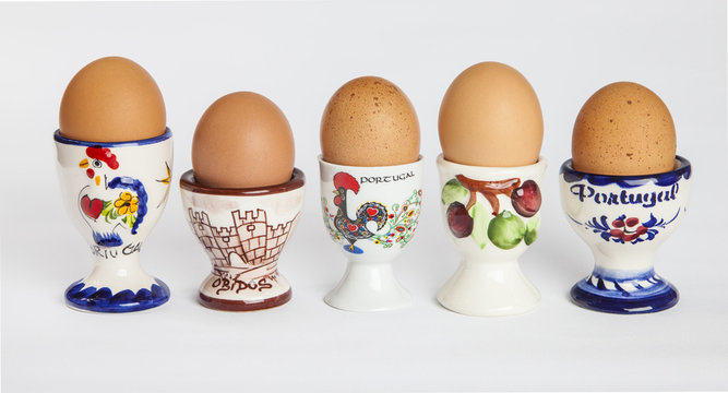 Set of portuguese egg cups with boiled eggs