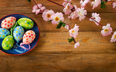 Colorful Easter eggs on  wooden background.