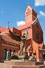 Fototapeta na wymiar Statue of Archangel Michael and the Catholic Church of St. Simon