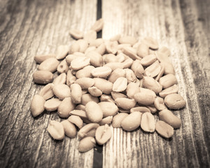 Salted peanuts on the wooden background