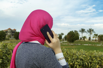 Muslim woman talking on the phone