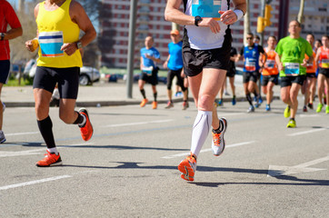 Fototapeta premium Marathon running race, runners feet on road, sport concept