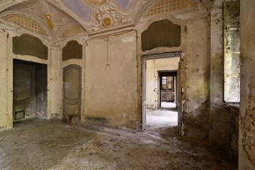 Old abandoned frescoed room in an italian villa.
