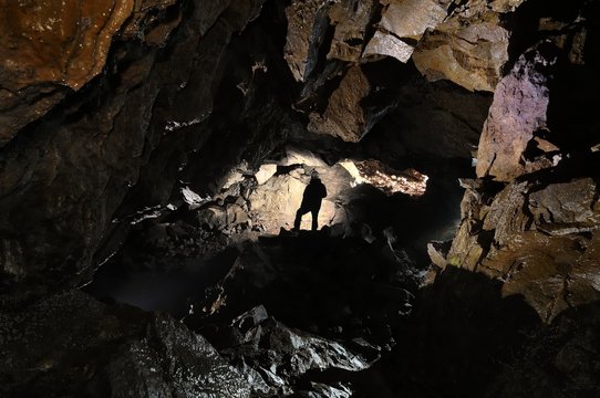caver in a cave, Pugnetto, Mezzenile, Piedmont, Italy