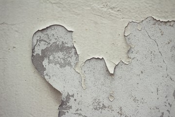 Cement wall with peeling paint