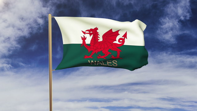 Wales flag with title waving in the wind. Looping sun rises