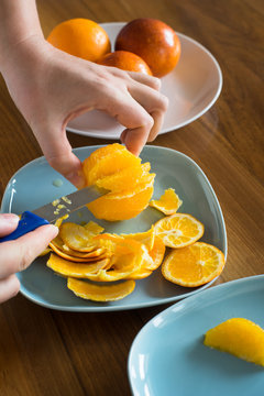 Cutting the Peeled Orange into the Segments