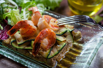 Fresh healthy salad with shrimps and vegetables serving on the