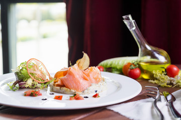 Creative composition delicious fresh smoked sliced salmon with