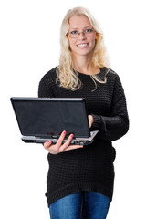 Young blond business woman wearing glasses holding a laptop
