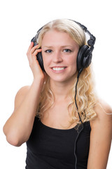 Young blond girl wearing headphones