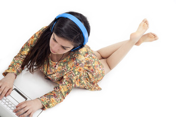 Teenage girl in headphones listening to the music