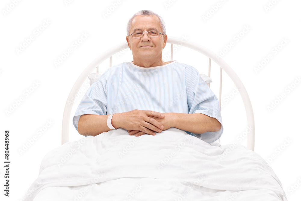 Sticker cheerful mature patient lying in a hospital bed