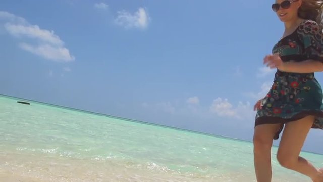 Elegant Female Legs Running Bare Feet Along Tropical Beach