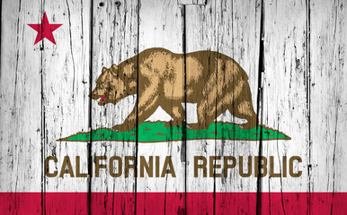 Naklejka premium Flaga stanu Kalifornia tło grunge