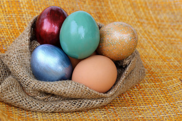 Colorful easter egg in sack bag.