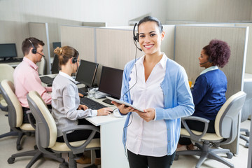 Happy Customer Service Representative Holding Tablet Computer