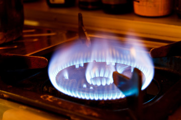 Flame on a gas stove in the kitchen.