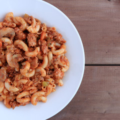 Macaroni and beef with vegetables and tomato sauce