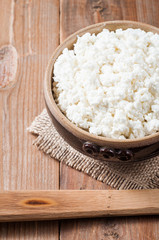 curd in brown bowl on wooden table background