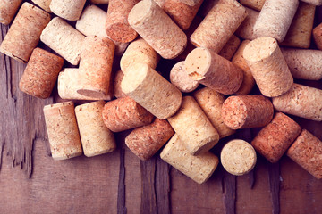 Wine corks on rustic wooden table background