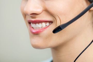 Smiling Female Customer Service Agent Wearing Headset
