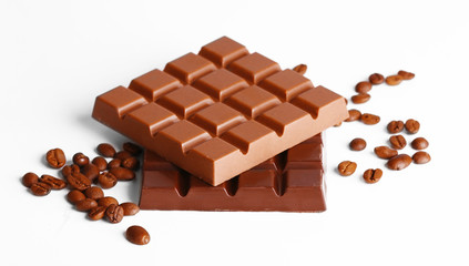 Milk and black chocolate bars with coffee beans isolated