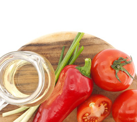Vegetables on cutting board, isolated on white.Top view