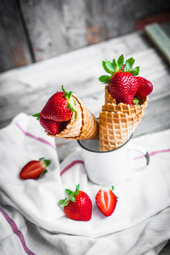 Strawberries in waffle cones