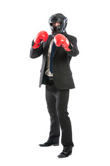 Business man wearing protective helmet and boxing gloves