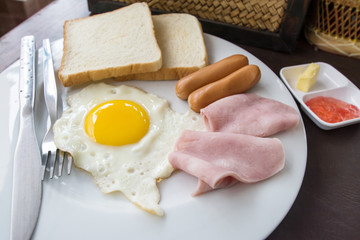 English breakfast with fried eggs, bacon, sausages,