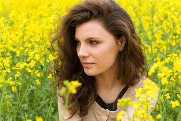 girl portrait in yellow flower field