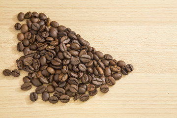 Coffee beans on wooden background