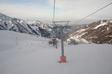 The cable car in the snowy mountains Chimbulak