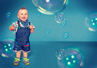funny little boy with bubbles
