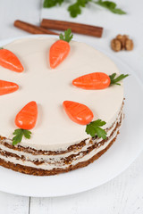 Baked easter carrot cake with icing and little carrots on top