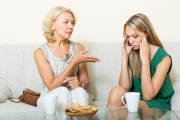  mother with   daughter having serious conversation