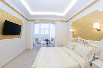 Luxurious bed with cushion in royal bedroom interior