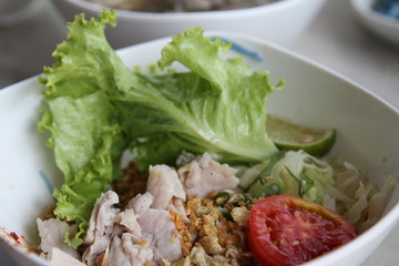 Dry noodles with steamed pork.