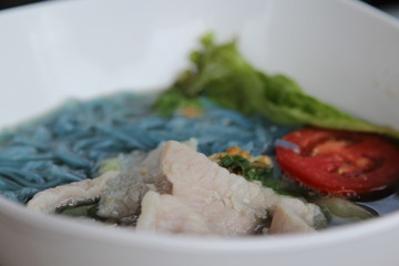 Crake noodles  with soup and steamed pork.