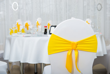 white interior with yellow napkins, sunny decor cafe