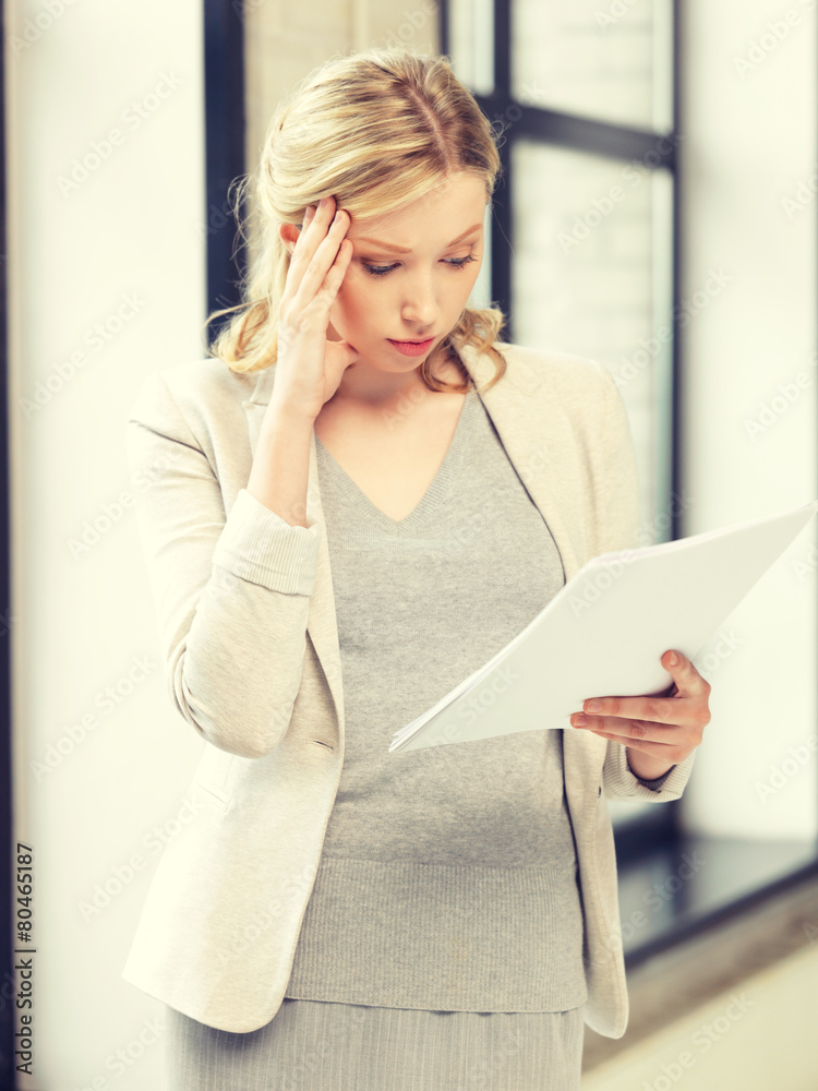 Wall mural worried woman with documents