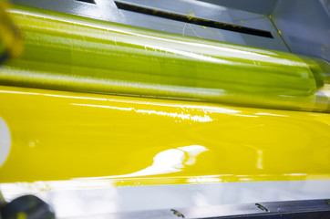 offset machine press print ink unit key yellow unit, close up