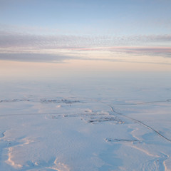 Road to oil field in tundra, top view