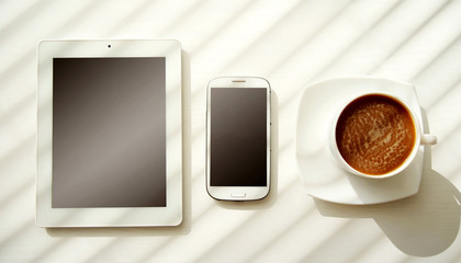 laptop, cell phone and cup of coffee