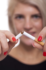 Close up Young Woman Breaking a Cigarette Stick