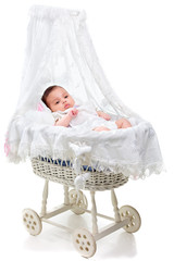 Fototapeta na wymiar Cute baby girl in a carriage